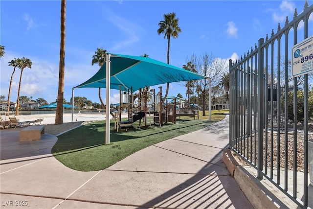 surrounding community featuring a playground and a yard