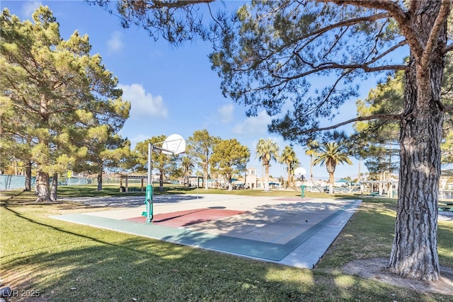 view of basketball court featuring a yard