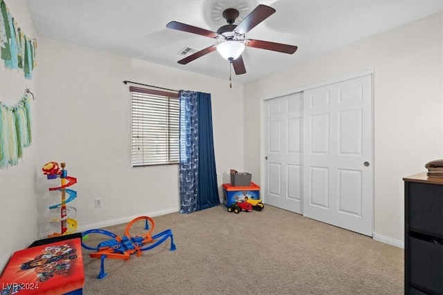 game room with carpet floors and ceiling fan