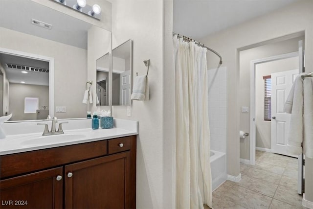 bathroom featuring shower / bath combo, vanity, and tile patterned floors