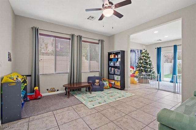 game room featuring ceiling fan and light tile patterned floors