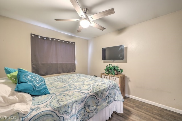 bedroom with dark wood-type flooring and ceiling fan