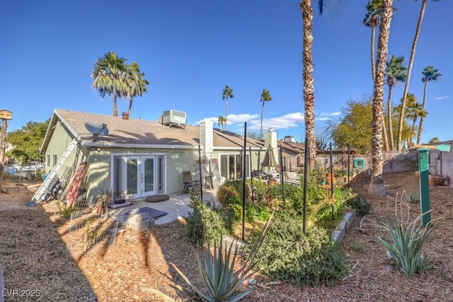 back of property featuring a patio and french doors