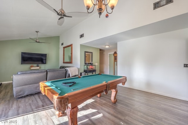 recreation room with wood-type flooring, lofted ceiling, pool table, and ceiling fan with notable chandelier