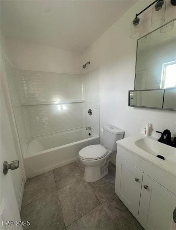 full bathroom featuring vanity, tiled shower / bath combo, and toilet