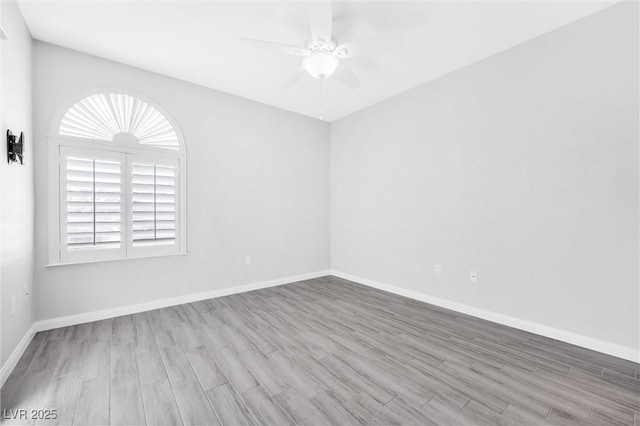 empty room featuring hardwood / wood-style floors and ceiling fan