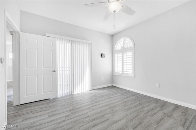 spare room with ceiling fan and light hardwood / wood-style flooring