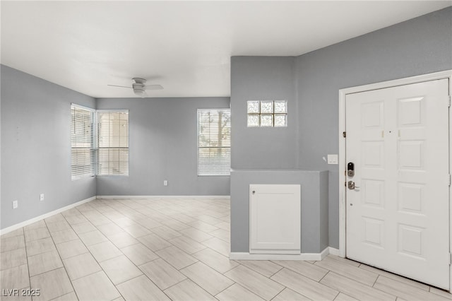 entryway featuring ceiling fan