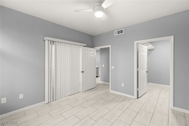 unfurnished bedroom featuring ceiling fan