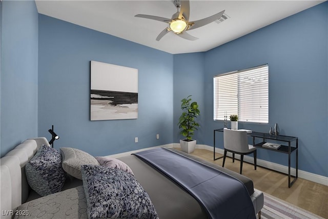 bedroom featuring ceiling fan and light colored carpet