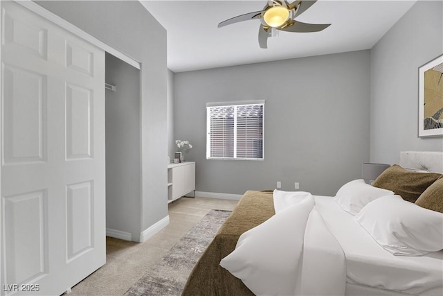 bedroom with light colored carpet and ceiling fan