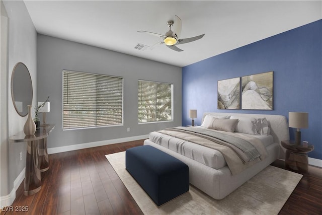 bedroom featuring ceiling fan and dark wood-type flooring