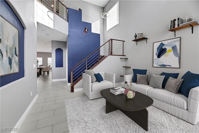 living room with a towering ceiling