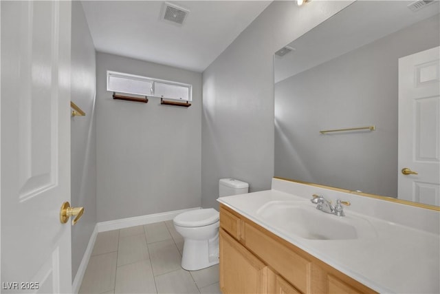 bathroom with tile patterned floors, vanity, and toilet