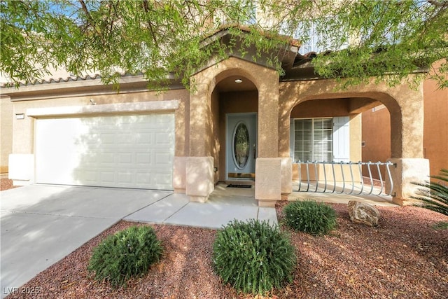 mediterranean / spanish-style home featuring a porch and a garage