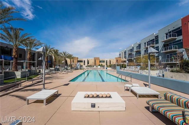 view of swimming pool featuring a patio