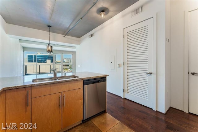 kitchen with pendant lighting, dishwasher, sink, a notable chandelier, and dark hardwood / wood-style flooring