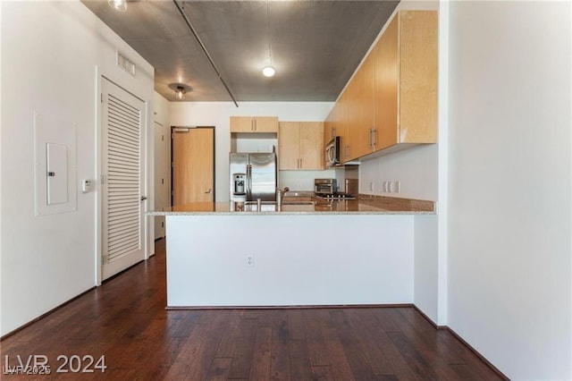 kitchen featuring kitchen peninsula, sink, light brown cabinets, and appliances with stainless steel finishes