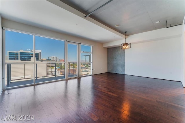 spare room with dark hardwood / wood-style flooring