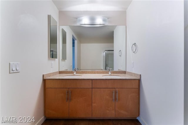 bathroom with vanity and an enclosed shower