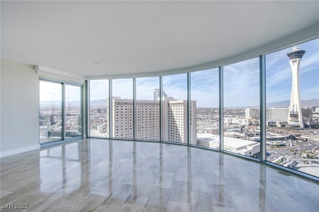 spare room featuring floor to ceiling windows