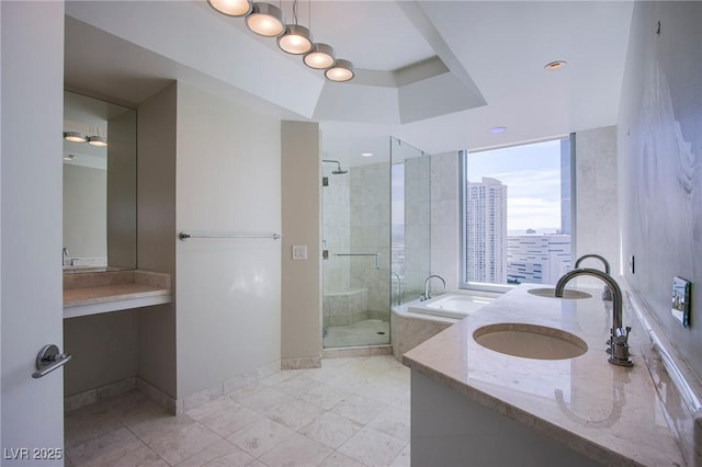 bathroom featuring vanity and shower with separate bathtub