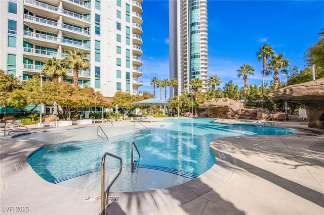 view of swimming pool with a patio area