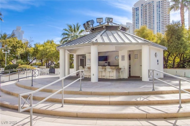 exterior space with an outdoor bar