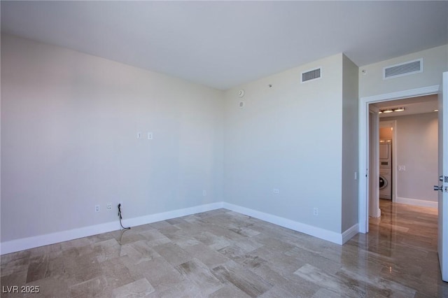 unfurnished room featuring washer / clothes dryer