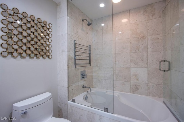 bathroom featuring toilet and enclosed tub / shower combo