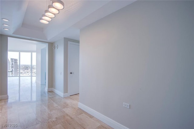 corridor with a tray ceiling