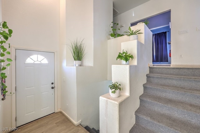 entryway with light hardwood / wood-style flooring