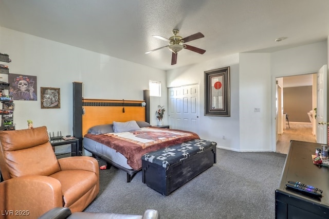 carpeted bedroom featuring a textured ceiling, a closet, and ceiling fan