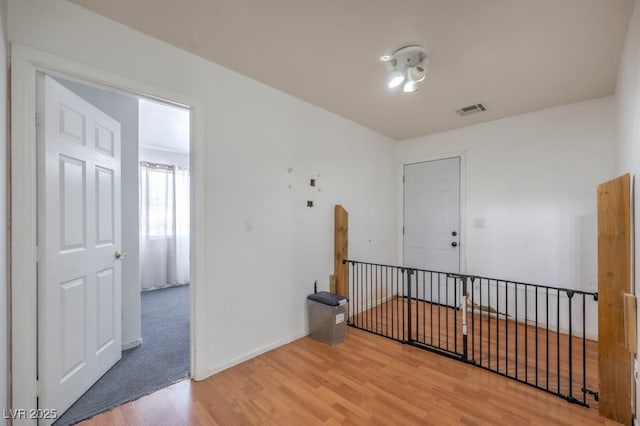 unfurnished room with wood-type flooring