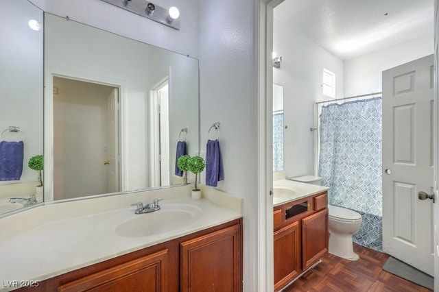 bathroom featuring toilet, vanity, a shower with shower curtain, and parquet flooring