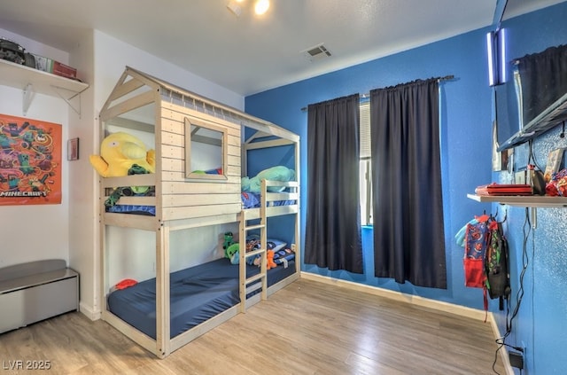 bedroom featuring hardwood / wood-style floors