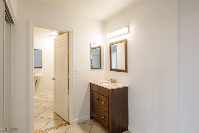 bathroom with tile patterned flooring and vanity