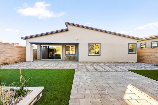 back of property featuring a patio area