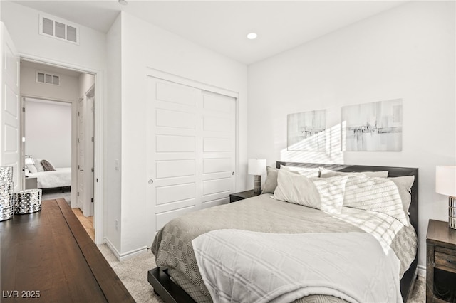 bedroom featuring a closet and carpet