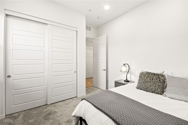 carpeted bedroom with a closet