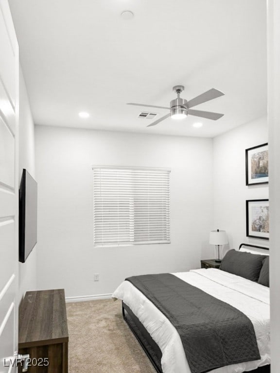 carpeted bedroom with ceiling fan