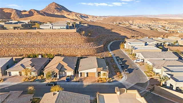 birds eye view of property with a mountain view