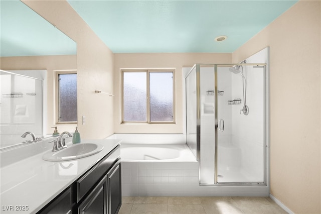 full bathroom with a bath, tile patterned flooring, a shower stall, and vanity