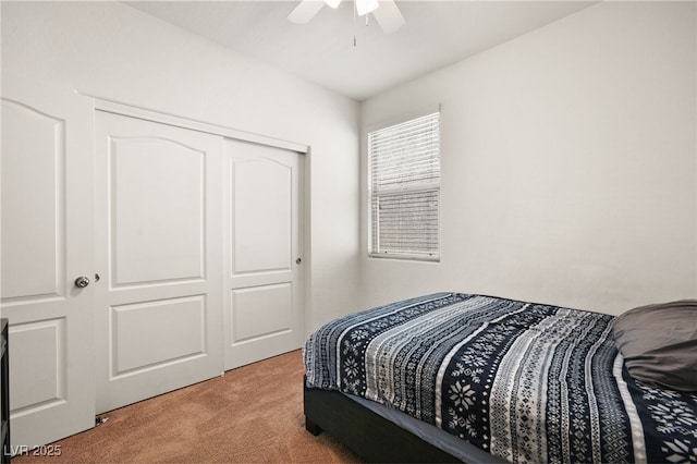 bedroom featuring a closet, carpet, and a ceiling fan