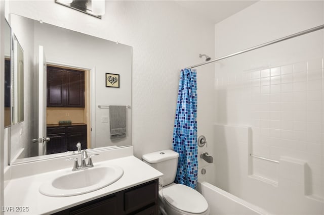 bathroom featuring vanity, shower / bath combination with curtain, and toilet