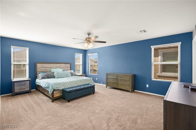 bedroom featuring ceiling fan and light colored carpet