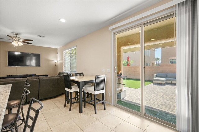 dining room with ceiling fan and light tile patterned flooring