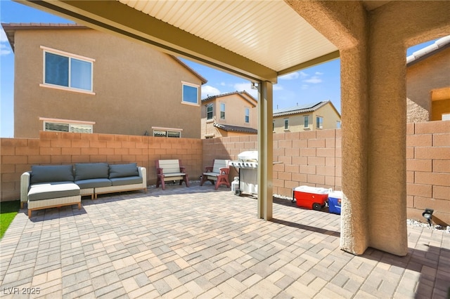 view of patio / terrace with an outdoor living space and a fenced backyard