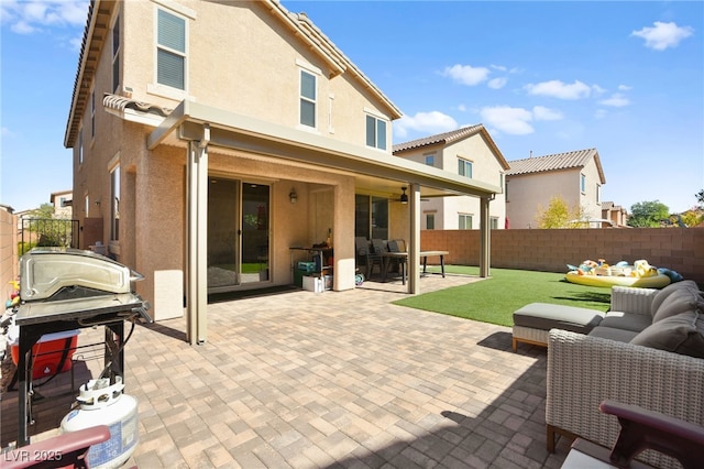 view of patio featuring outdoor lounge area and a fenced backyard