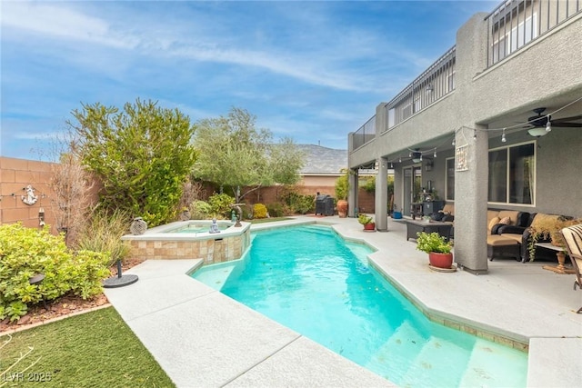 view of swimming pool featuring ceiling fan, a patio area, an outdoor hangout area, and an in ground hot tub